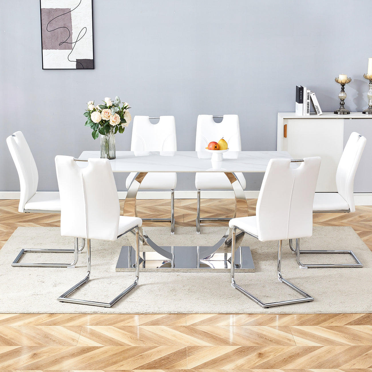 Table and chair set.63x31.5x30-inch Sintered Stone Dining Table - A Perfect Blend of Durability and Elegance.Paired with 6 Uniquely designed White Dining Chairs With Silver Metal Leg.
