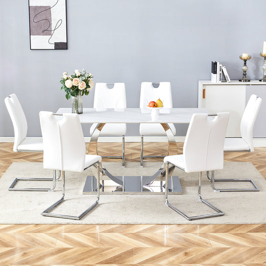 Table and chair set.63x31.5x30-inch Sintered Stone Dining Table - A Perfect Blend of Durability and Elegance.Paired with 6 Uniquely designed White Dining Chairs With Silver Metal Leg.