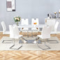 Table and chair set.63x31.5x30-inch Sintered Stone Dining Table - A Perfect Blend of Durability and Elegance.Paired with 6 Uniquely designed White Dining Chairs With Silver Metal Leg.