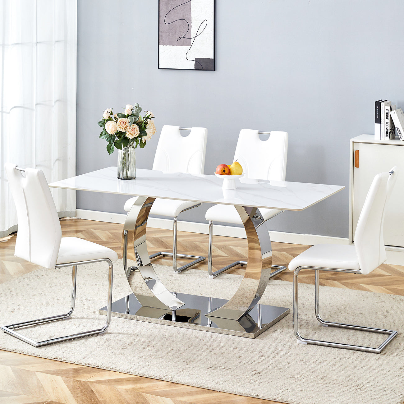 Table and chair set.63x31.5x30-inch Sintered Stone Dining Table - A Perfect Blend of Durability and Elegance.Paired with 4 Uniquely designed white dining chairs with Silver Metal Leg.