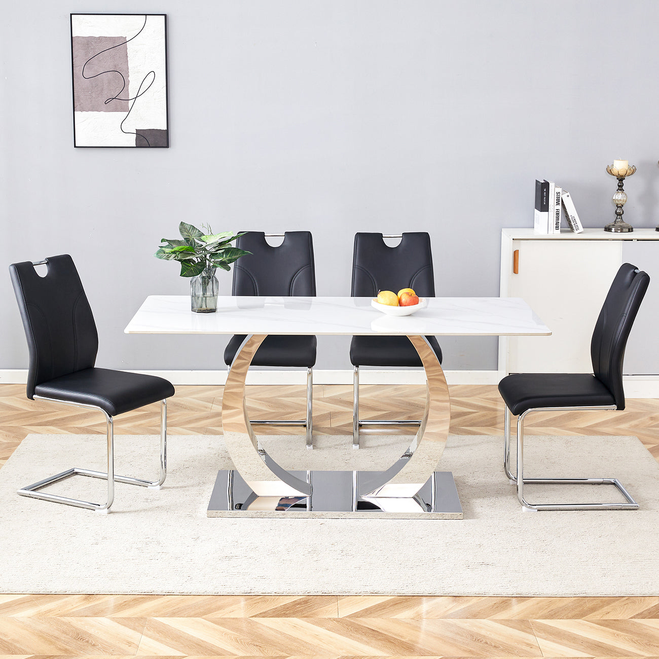 Table and chair set.63x31.5x30-inch Sintered Stone Dining Table - A Perfect Blend of Durability and Elegance.Paired with 4 Uniquely designed Black Dining Chairs With Silver Metal Leg.